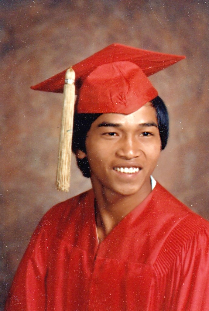 A picture of Paul S. Tuon in a graduation gown